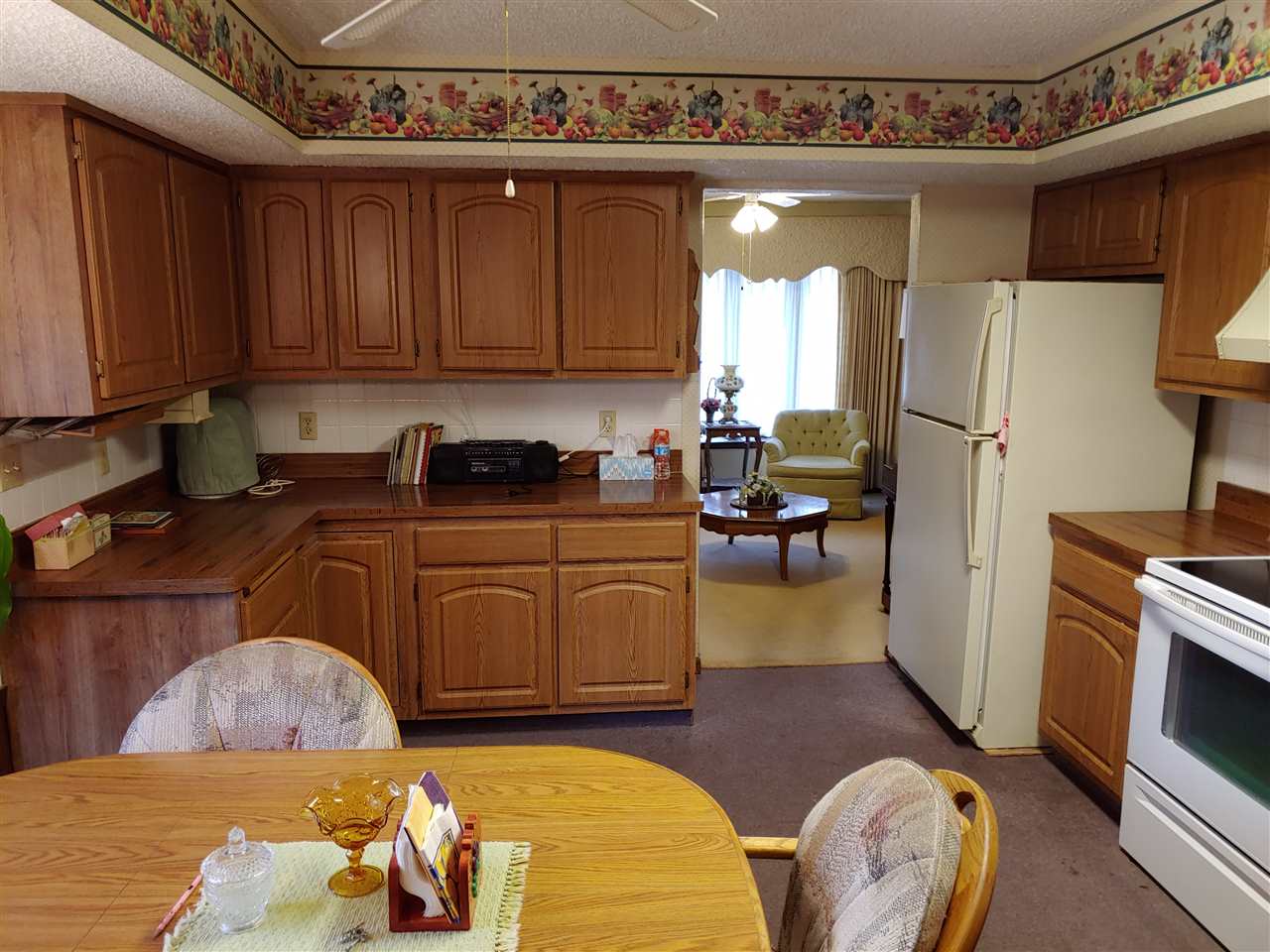 2874 Karr Road Belvidere, IL 61008 - Photo 8 of 20 a kitchen with a refrigerator and a stove top oven