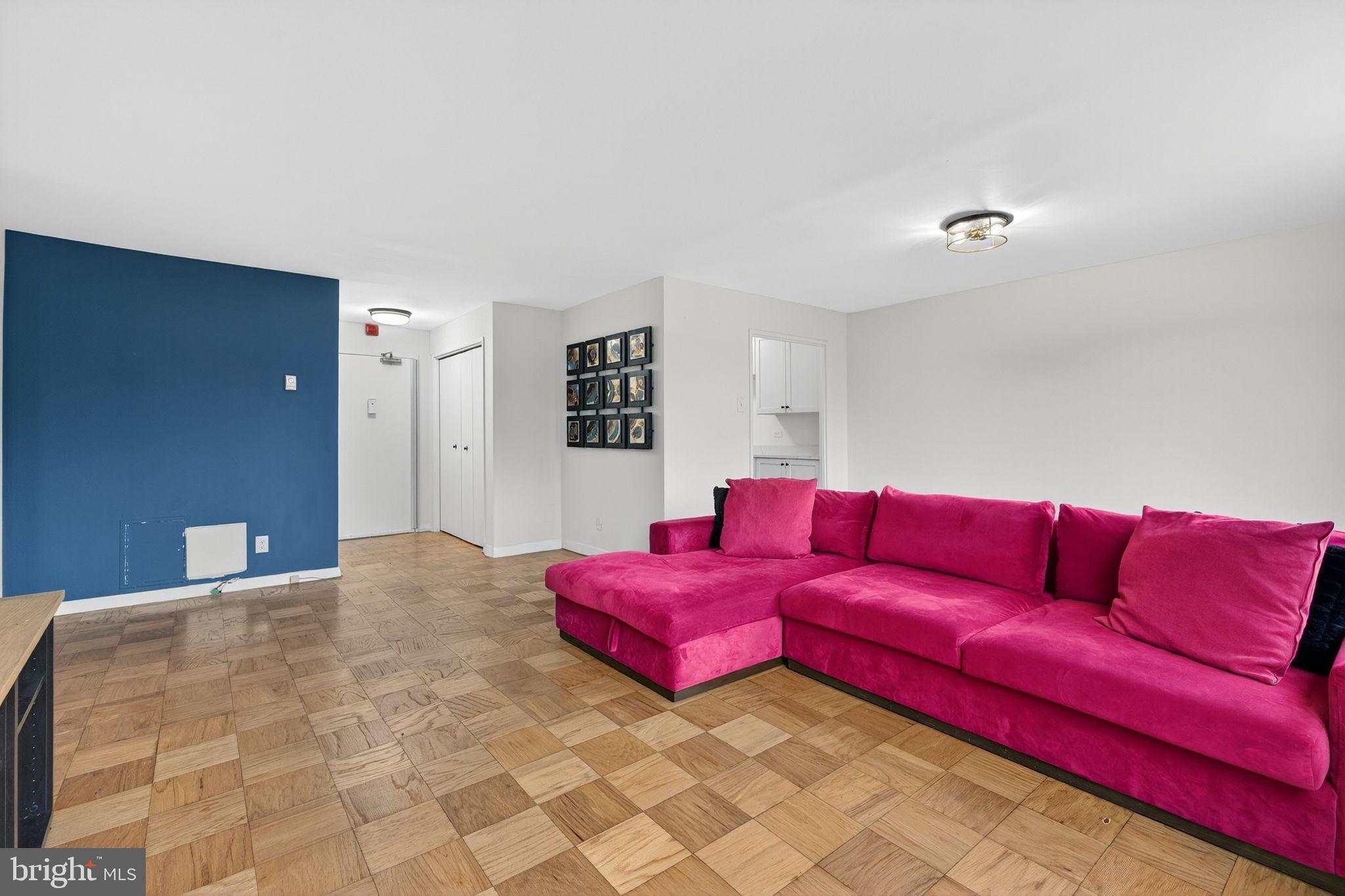 1900 Lyttonsville Road, Unit 618 Silver Spring, MD 20910 - Photo 11 of 36 a living room with furniture and a couch