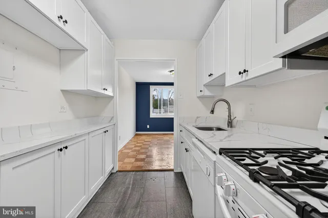 a kitchen with a stove and a sink