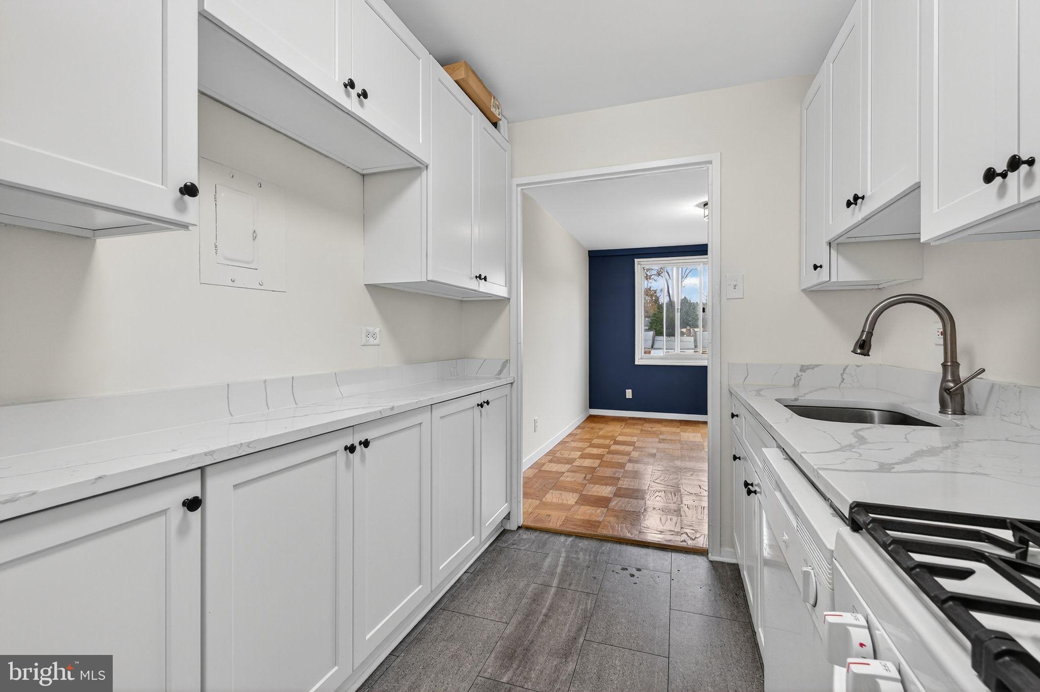 1900 Lyttonsville Road, Unit 618 Silver Spring, MD 20910 - Photo 18 of 36 a kitchen with a sink and stove