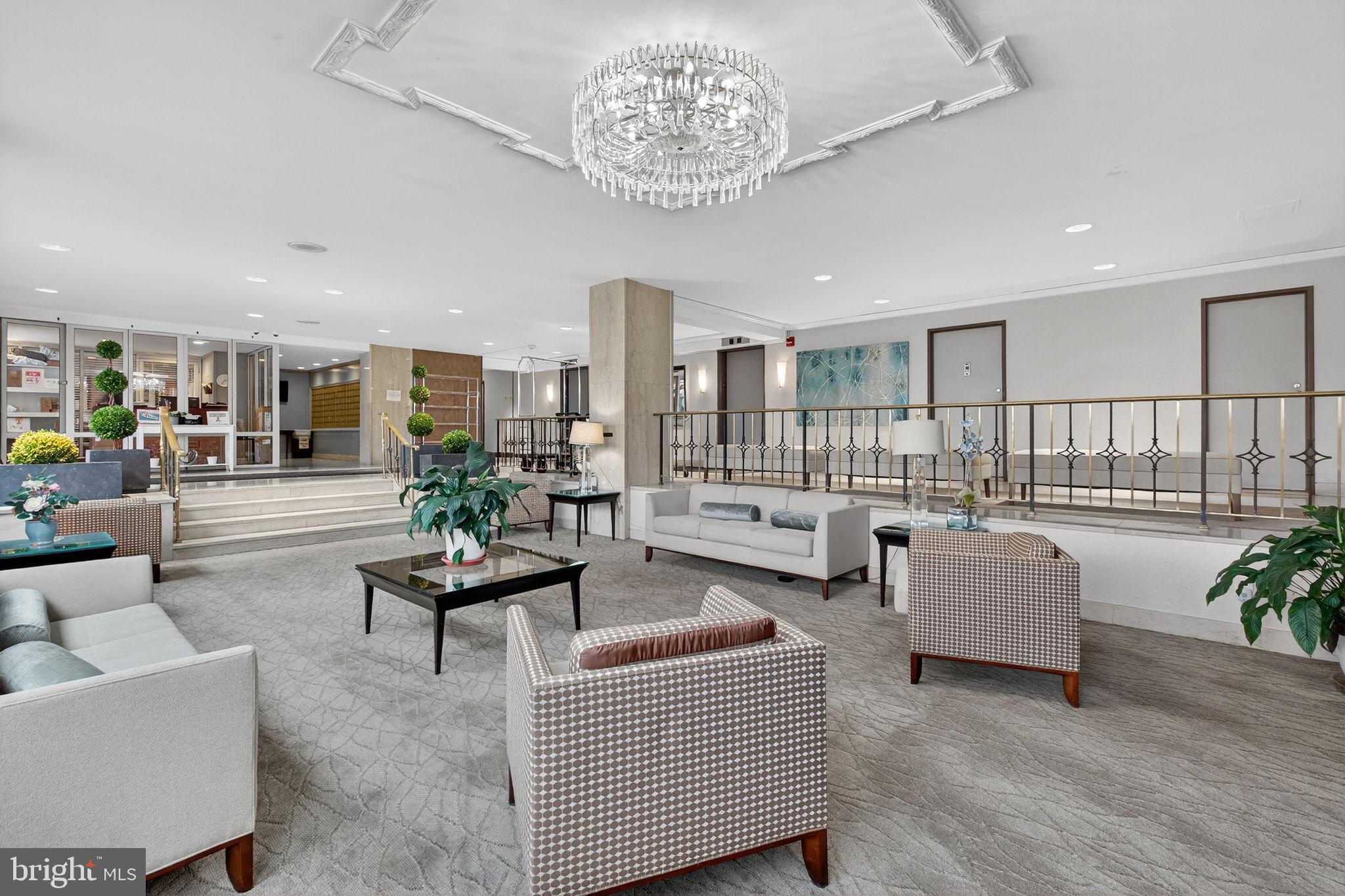 1900 Lyttonsville Road, Unit 618 Silver Spring, MD 20910 - Photo 3 of 36 a living room with furniture and a chandelier