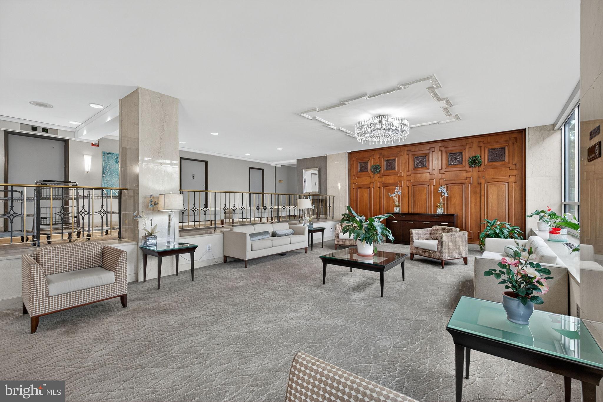 1900 Lyttonsville Road, Unit 618 Silver Spring, MD 20910 - Photo 5 of 36 a living room with furniture and a large window