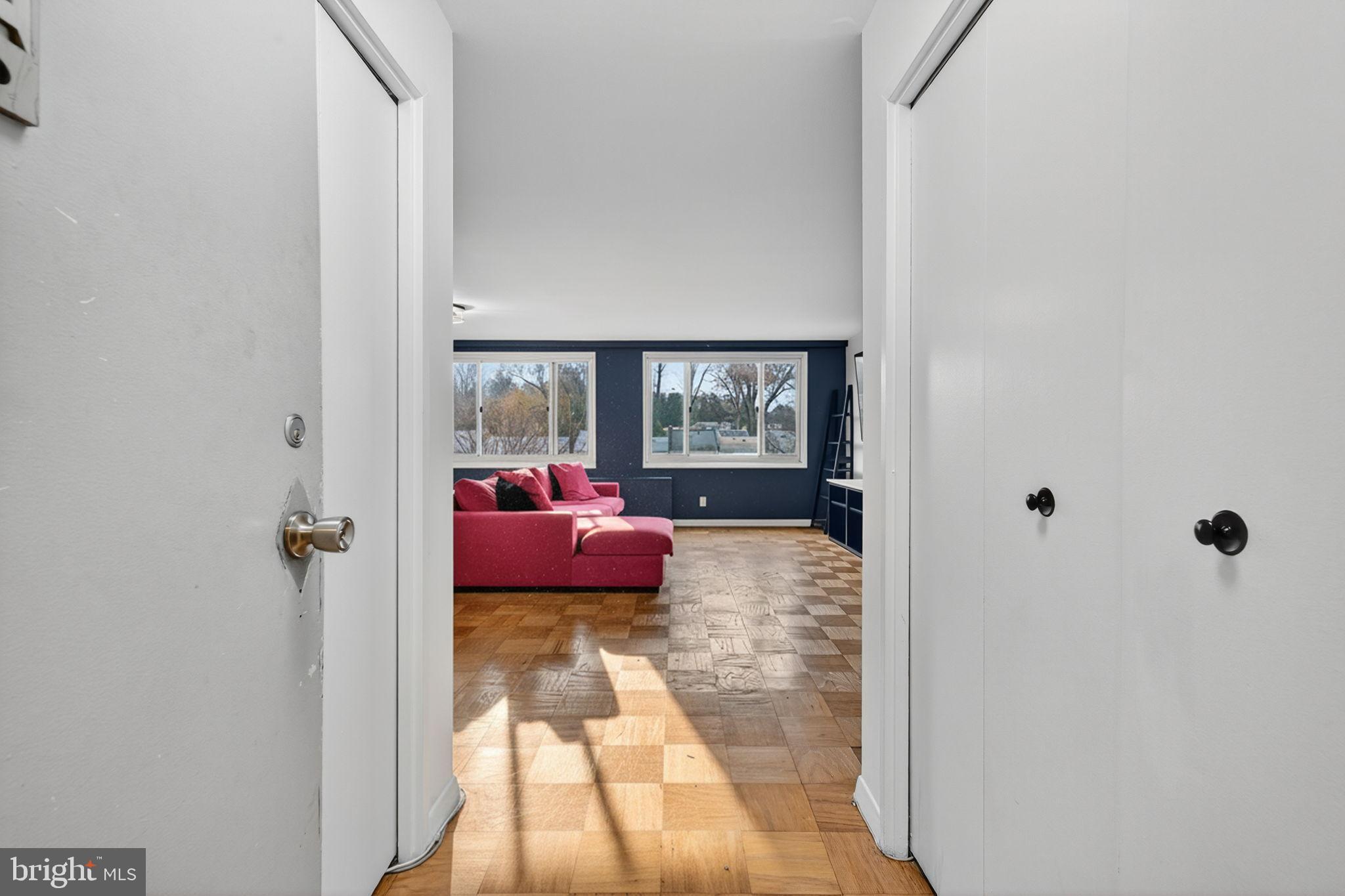 1900 Lyttonsville Road, Unit 618 Silver Spring, MD 20910 - Photo 6 of 36 a bedroom with a bed and a window