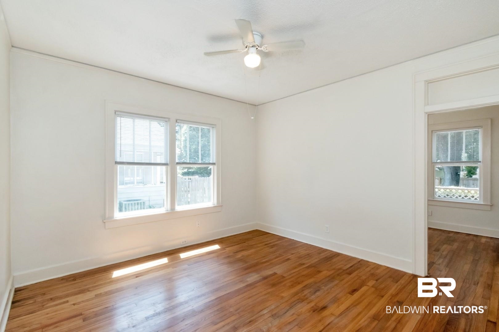 112 South Fulton Street Mobile, AL 36606 - Photo 22 of 35 Empty room with ceiling fan and hardwood / wood-style flooring