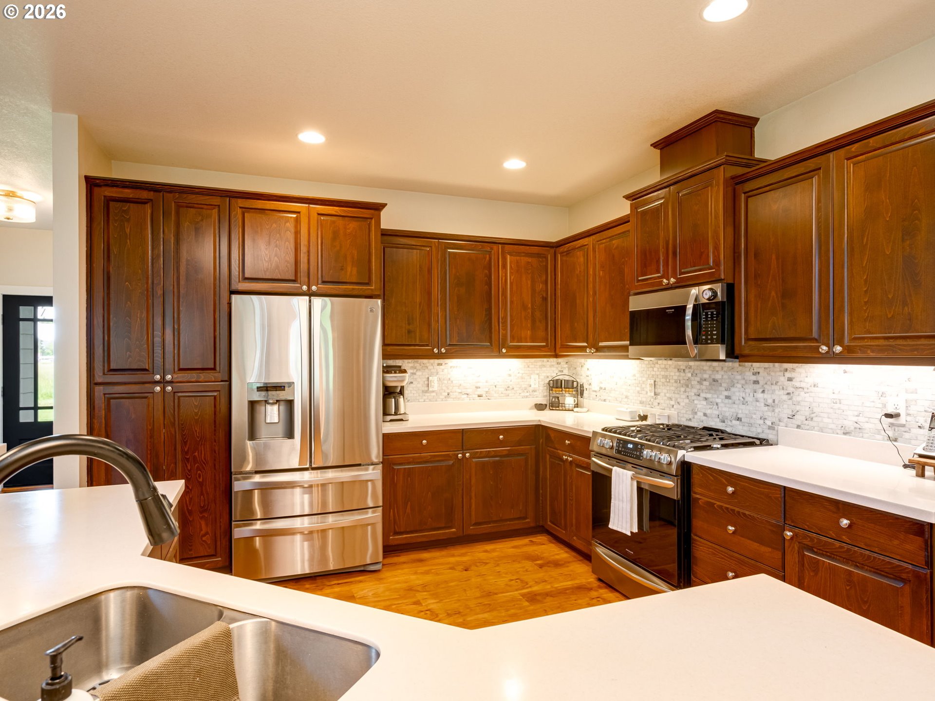 14200 South Union Mills Road Mulino, OR 97042 - Photo 11 of 46 a kitchen with stainless steel appliances granite countertop a sink stove and refrigerator