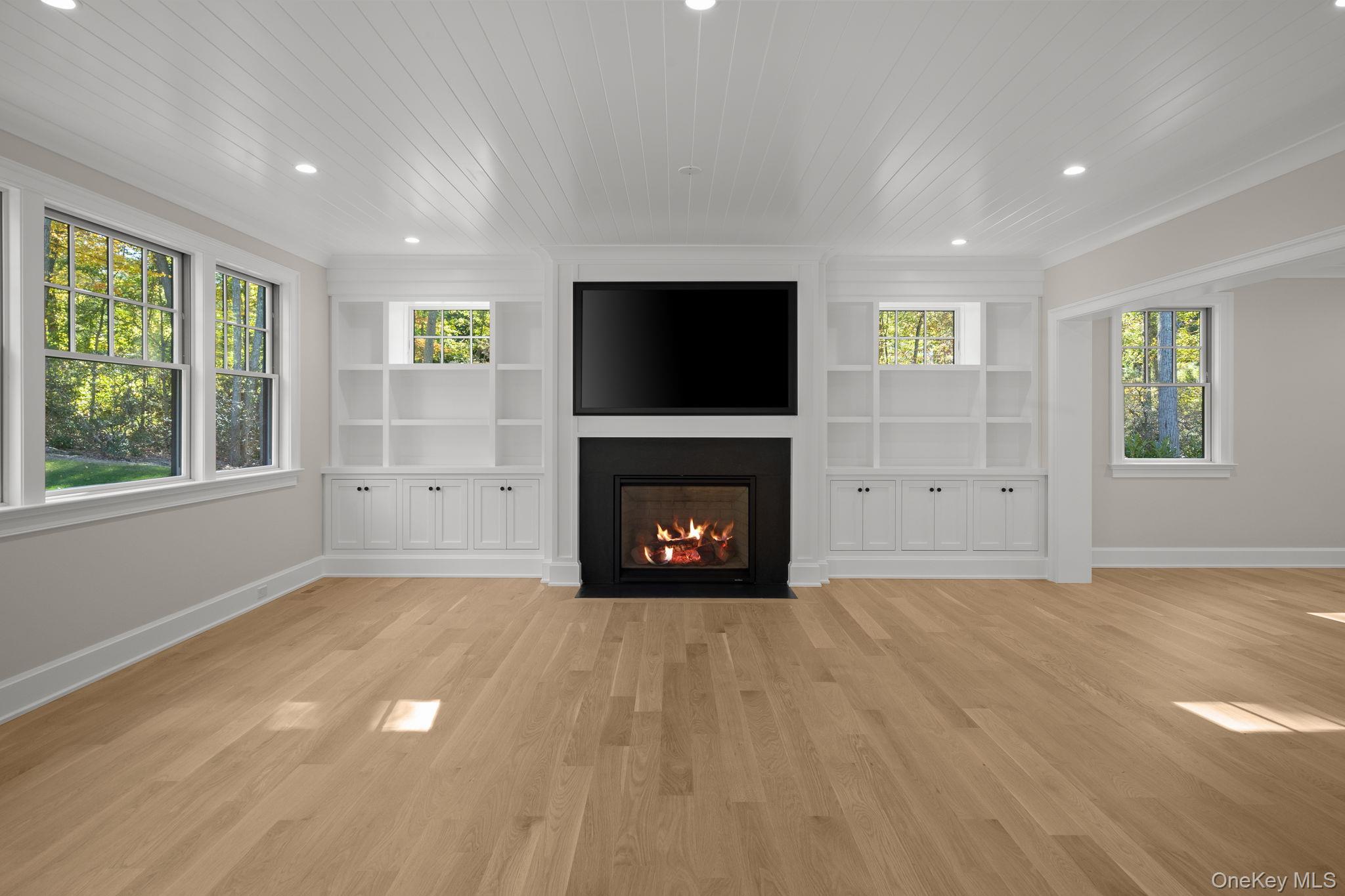 66 Saw Mill Road Cold Spring Harbor, NY 11724 - Photo 16 of 40 a view of an empty room with window and fire place