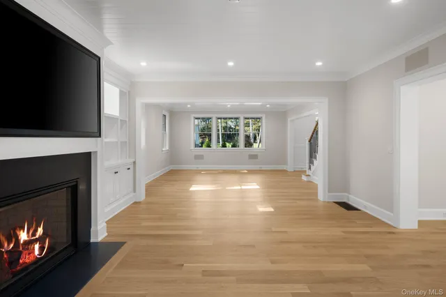 a view of an empty room with a fireplace