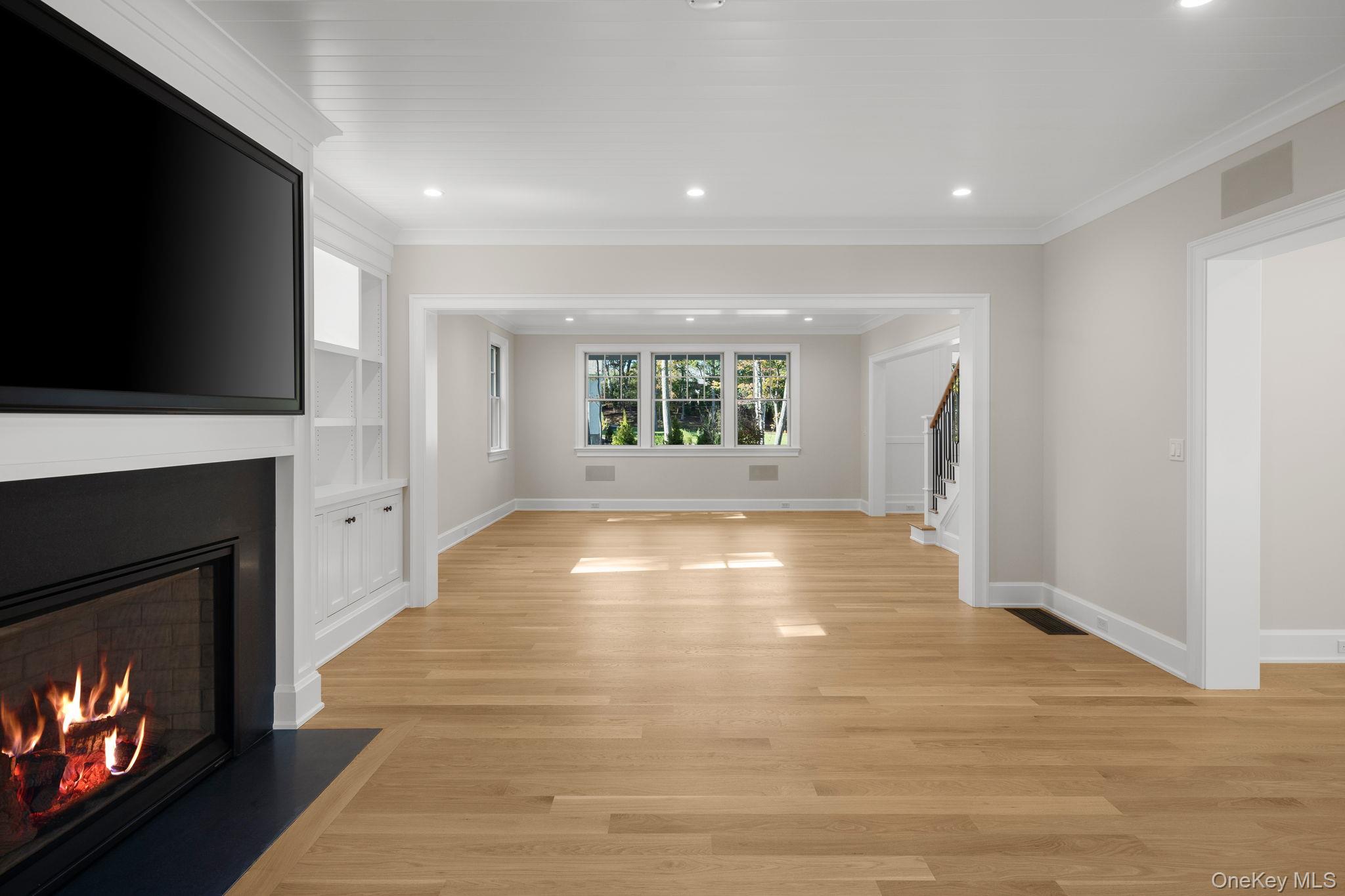 66 Saw Mill Road Cold Spring Harbor, NY 11724 - Photo 17 of 40 a view of an empty room with a fireplace