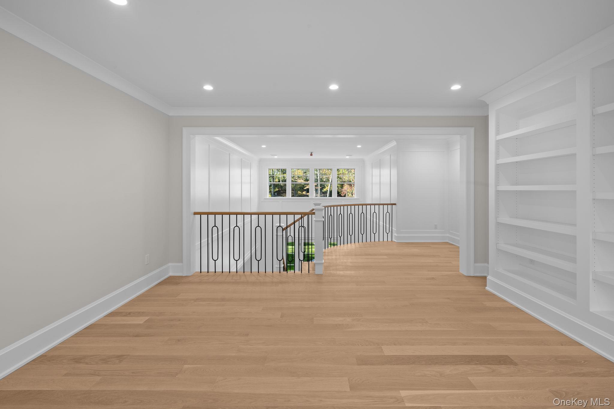 66 Saw Mill Road Cold Spring Harbor, NY 11724 - Photo 24 of 40 a view of an empty room with wooden floor