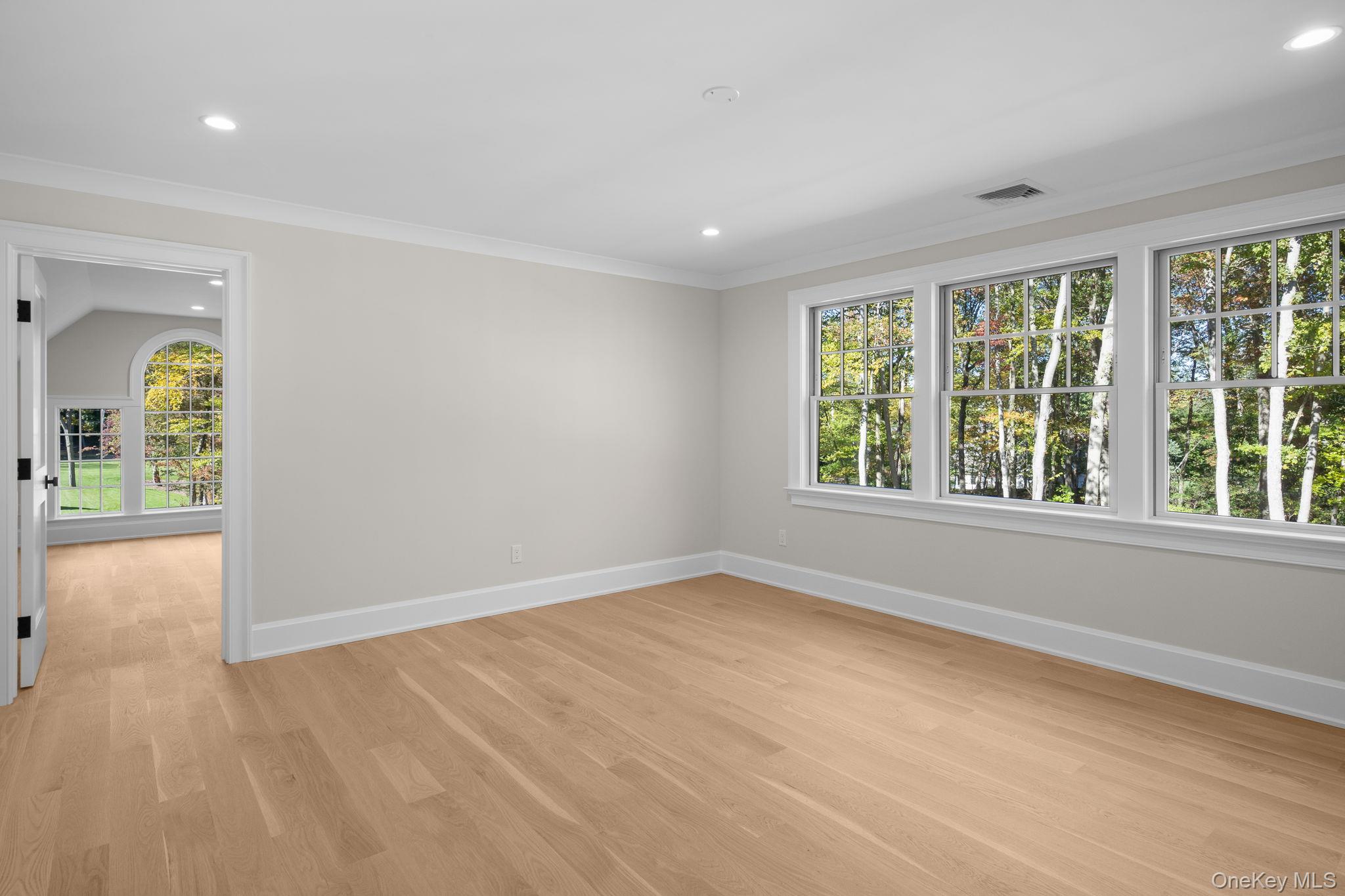 66 Saw Mill Road Cold Spring Harbor, NY 11724 - Photo 28 of 40 wooden floor in an empty room with a window