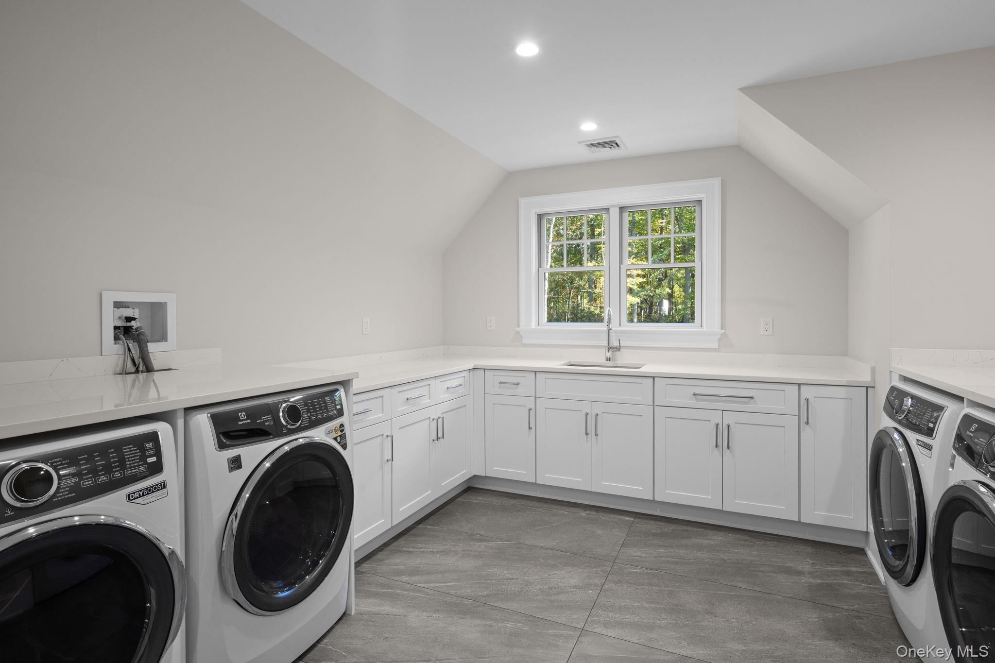 66 Saw Mill Road Cold Spring Harbor, NY 11724 - Photo 30 of 40 a utility room with sink dryer and washer