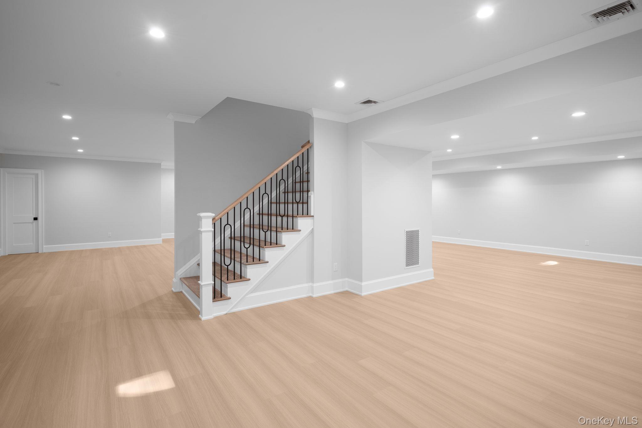 66 Saw Mill Road Cold Spring Harbor, NY 11724 - Photo 31 of 40 a view of an empty room with wooden floor