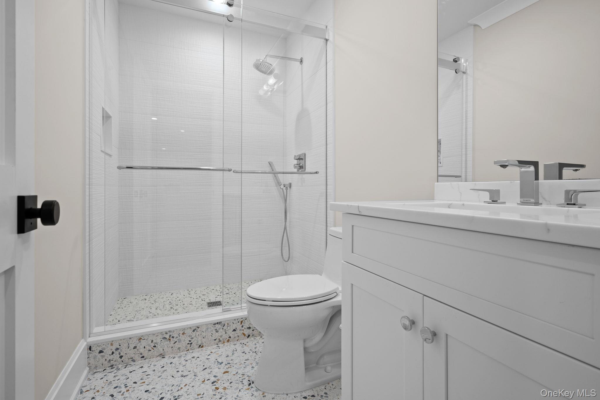 66 Saw Mill Road Cold Spring Harbor, NY 11724 - Photo 34 of 40 a bathroom with a sink a toilet and shower