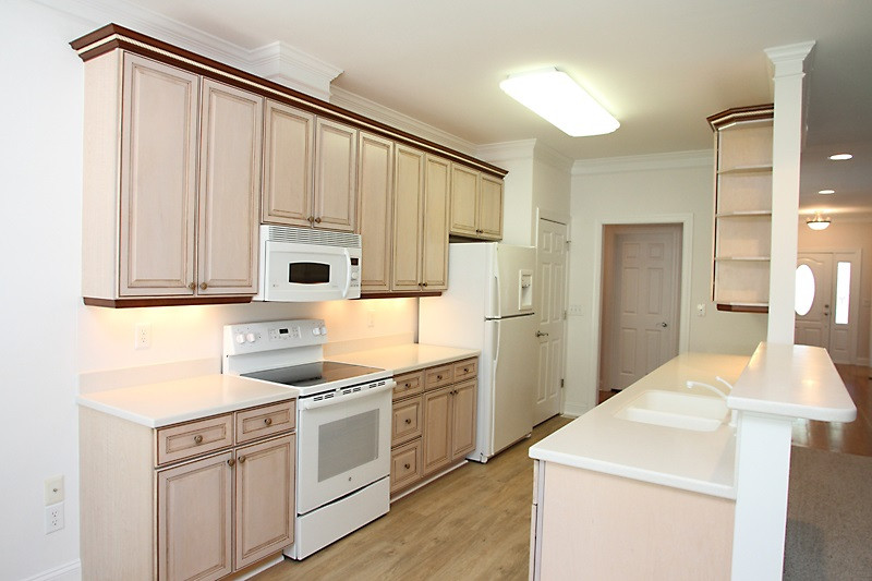 11612 Midlavian Drive Raleigh, NC 27614 - Photo 5 of 25 The super efficient kitchen has a new range, it is also ready for a gas range! Large pantry, desk space too. It is open to the family room and nook Kitchen
