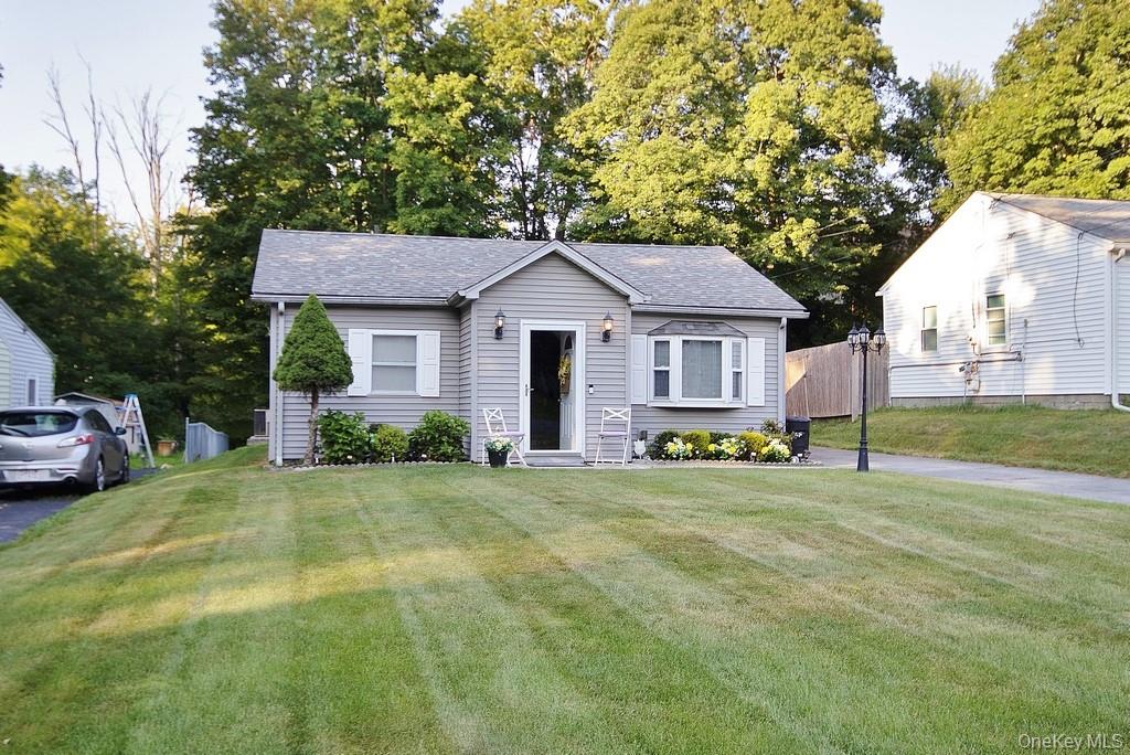 27 Forshee Street Monroe, NY 10950 - Photo 1 of 1 Bungalow-style house with roof with shingles and view of scattered trees