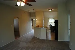 a view of a kitchen with a refrigerator
