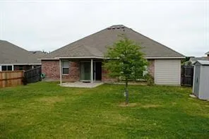 a view of a house with a yard and sitting area