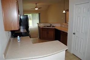 a kitchen with stainless steel appliances a refrigerator and a stove