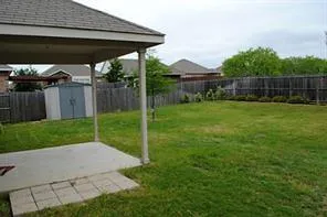 a view of backyard with green space