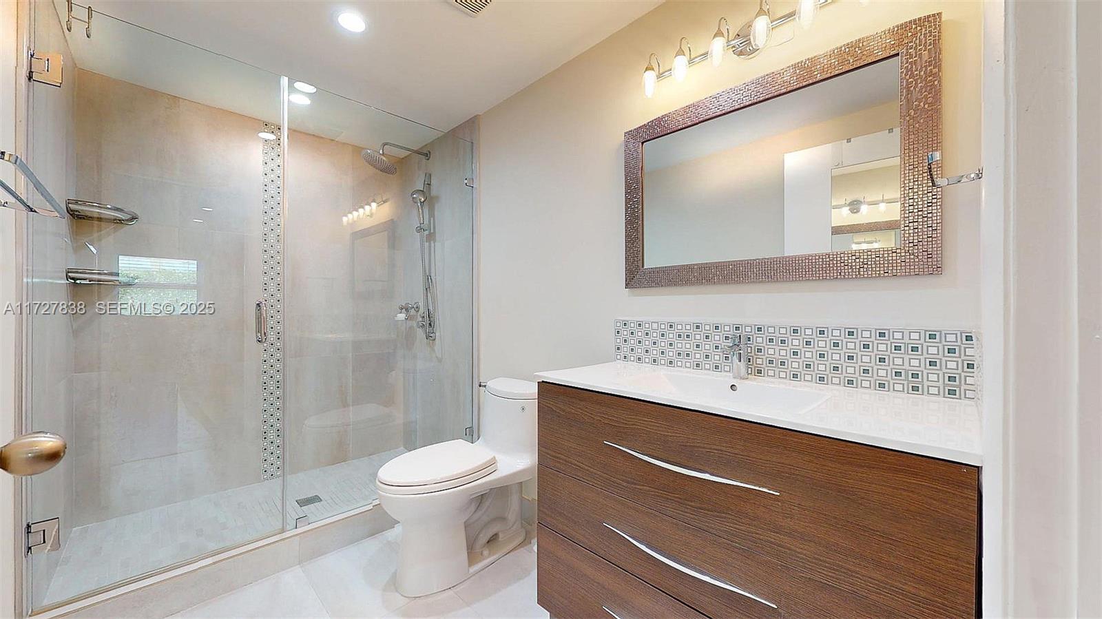 28 Center Lane Key Largo, FL 33037 - Photo 12 of 93 a bathroom with a sink a toilet and shower