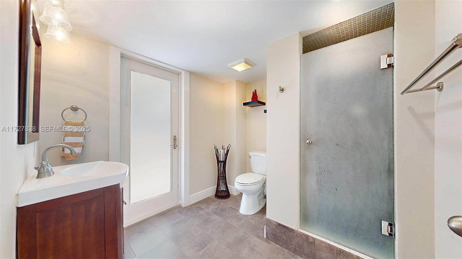 28 Center Lane Key Largo, FL 33037 - Photo 13 of 93 a bathroom with a sink and a mirror