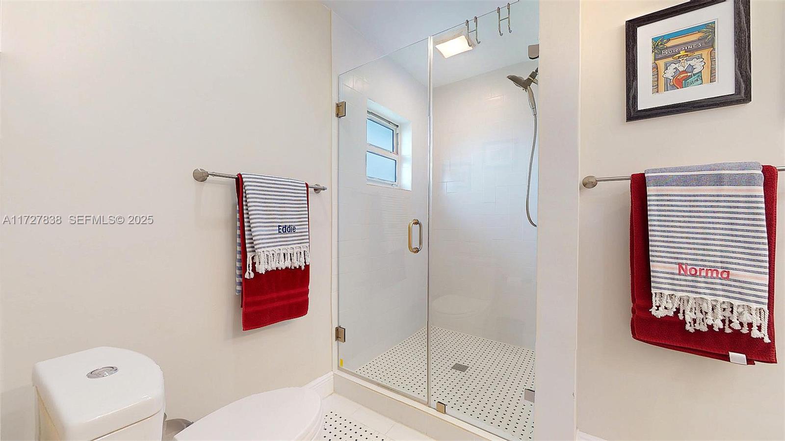 28 Center Lane Key Largo, FL 33037 - Photo 25 of 93 a bathroom with a shower and a toilet