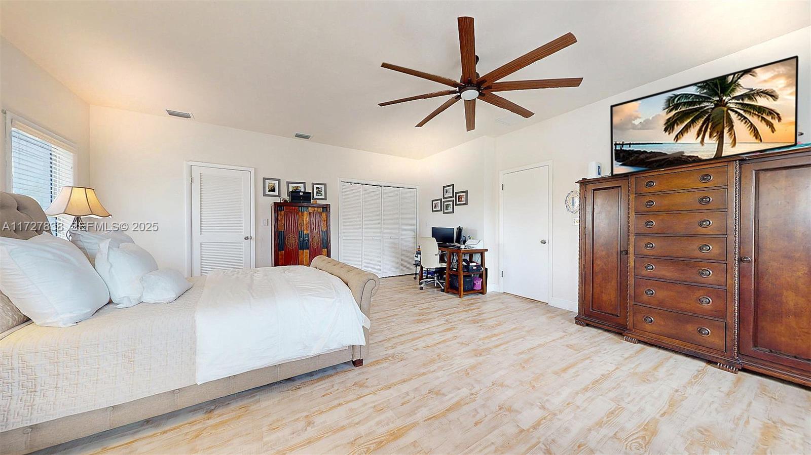 28 Center Lane Key Largo, FL 33037 - Photo 28 of 93 a bedroom with a bed and a chandelier