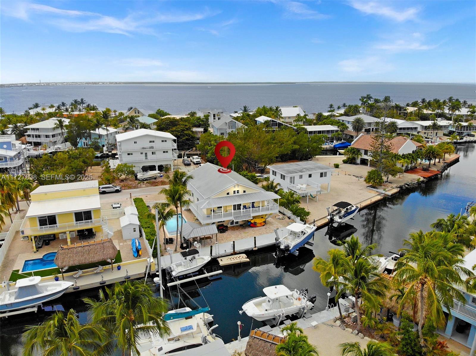 28 Center Lane Key Largo, FL 33037 - Photo 46 of 93 an aerial view of multiple houses with outdoor space