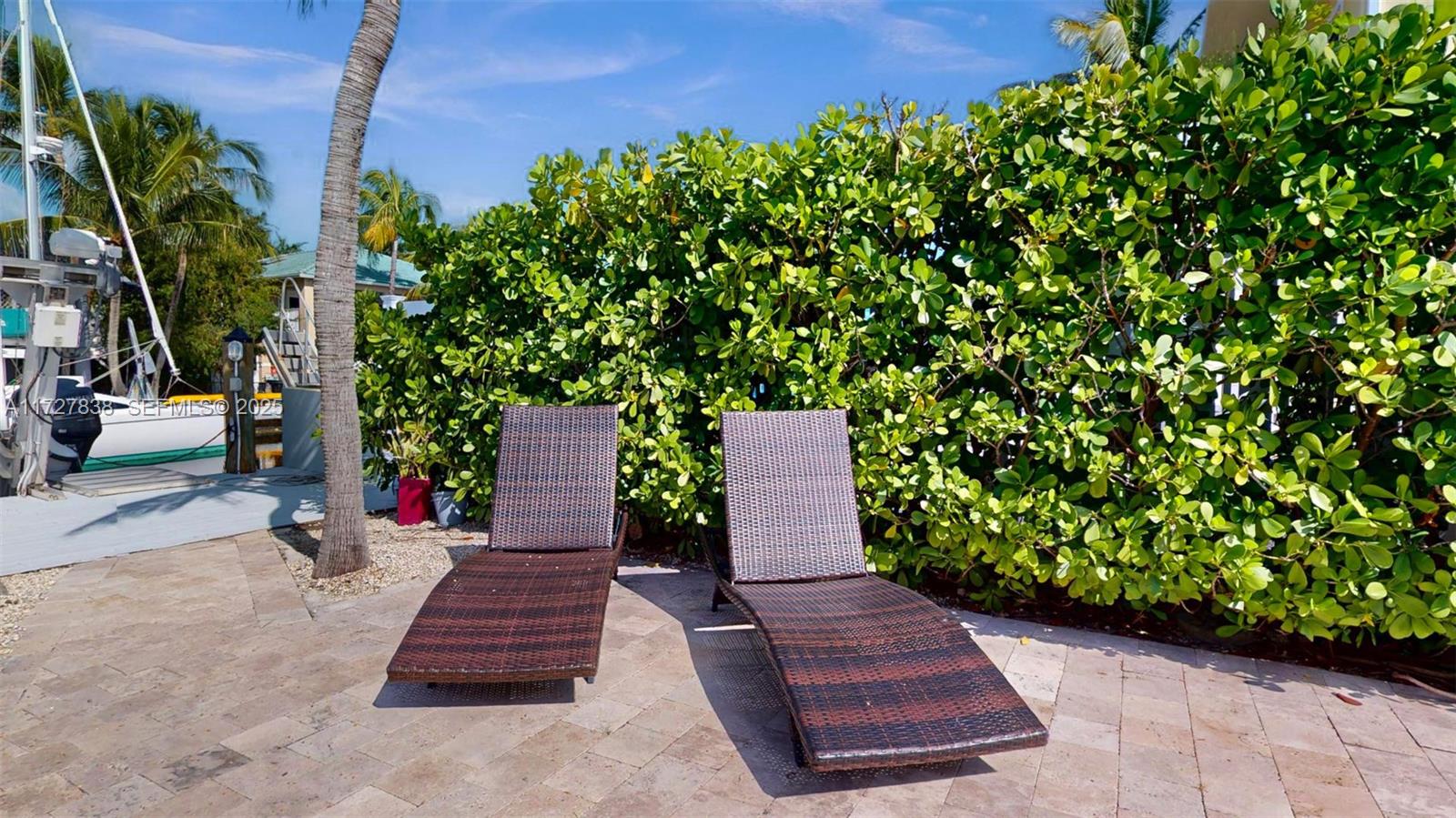 28 Center Lane Key Largo, FL 33037 - Photo 61 of 93 a wooden bench sitting in front of a building