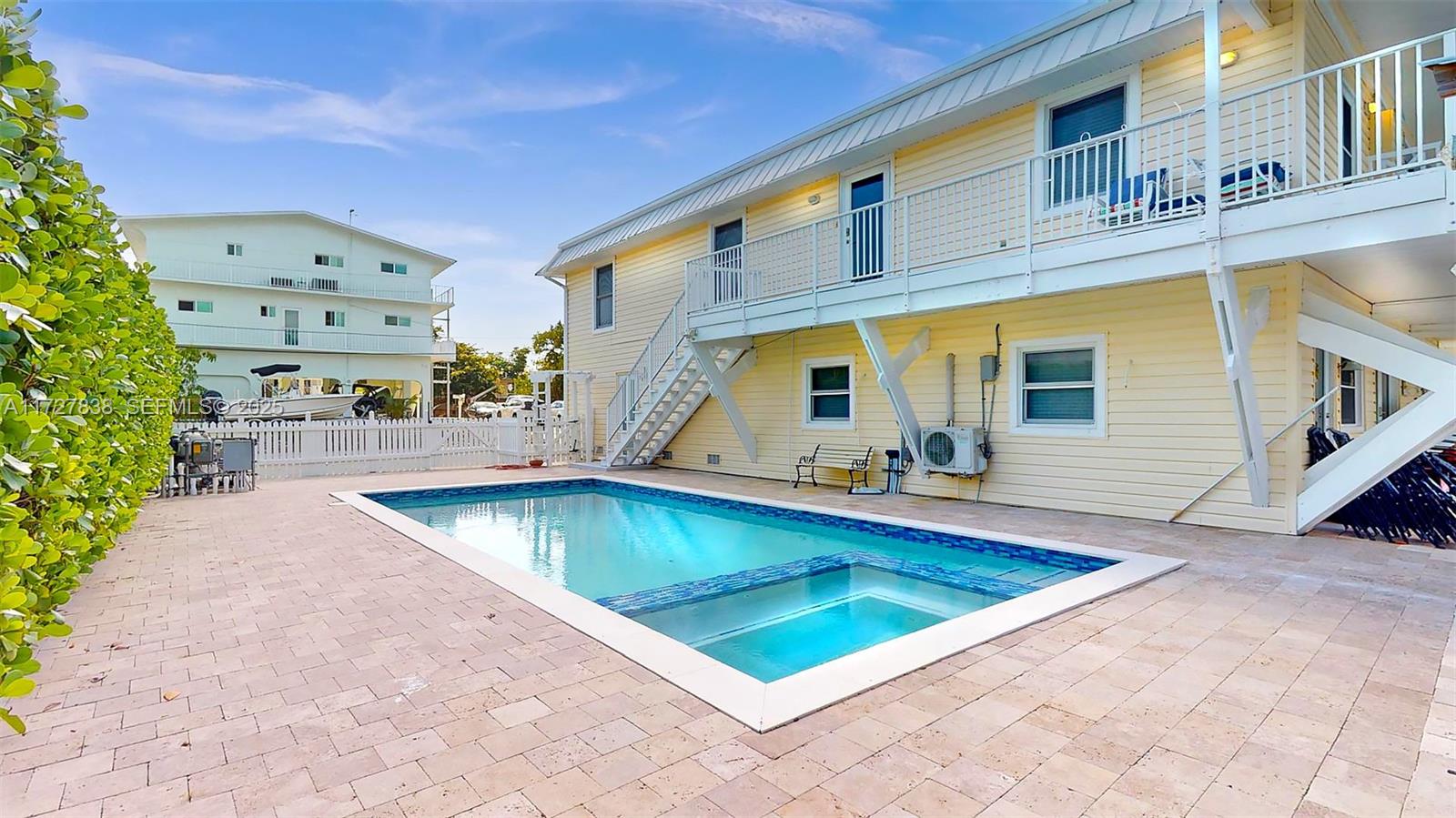 28 Center Lane Key Largo, FL 33037 - Photo 70 of 93 a view of swimming pool with a lounge chairs