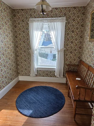 a bedroom with a bed and a large mirror