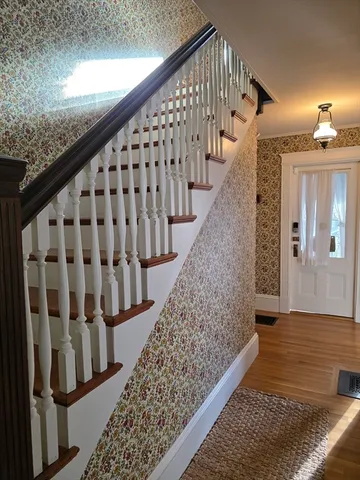 a view of entryway with wooden floor
