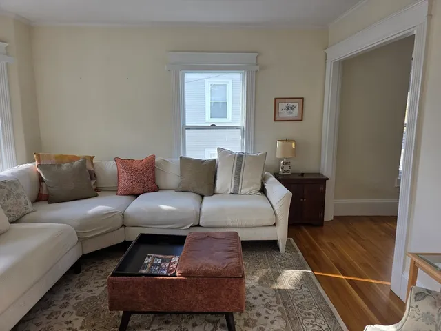 a living room with furniture and a rug