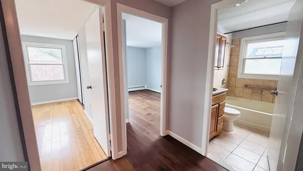 a view of a bathroom with a tub and shower
