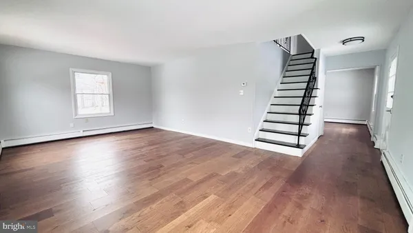 wooden floor in a room with a window