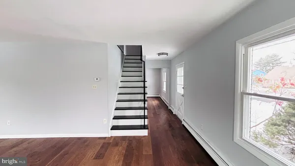 a view of entryway with wooden floor