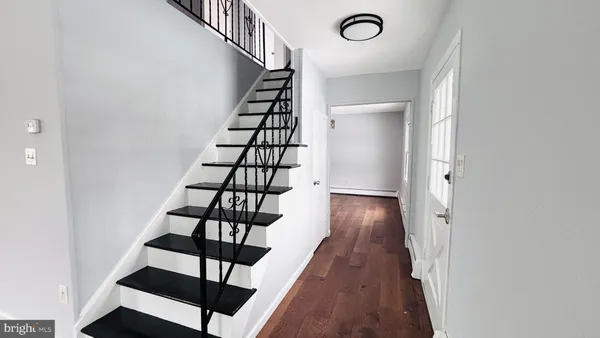 a view of entryway with wooden floor