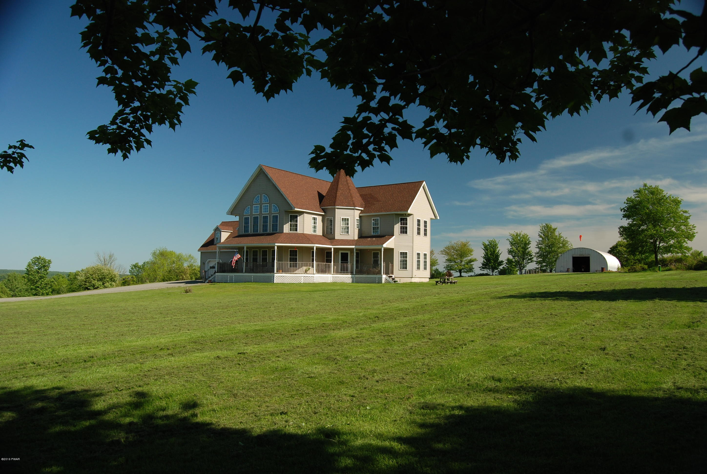 176 Highland Road Pleasant Mount, PA 18453 - Photo 35 of 52 a front view of a house with a garden