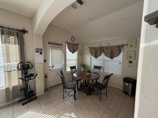6720 Cromarty Lane Austin, TX 78754 - Photo 12 of 24 A well-lit sunroom with ample space for dining and relaxation.