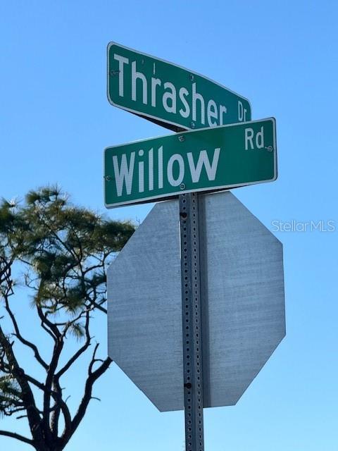 7 Willow Road Placida, FL 33946 - Photo 9 of 11 a street sign that is on a pole