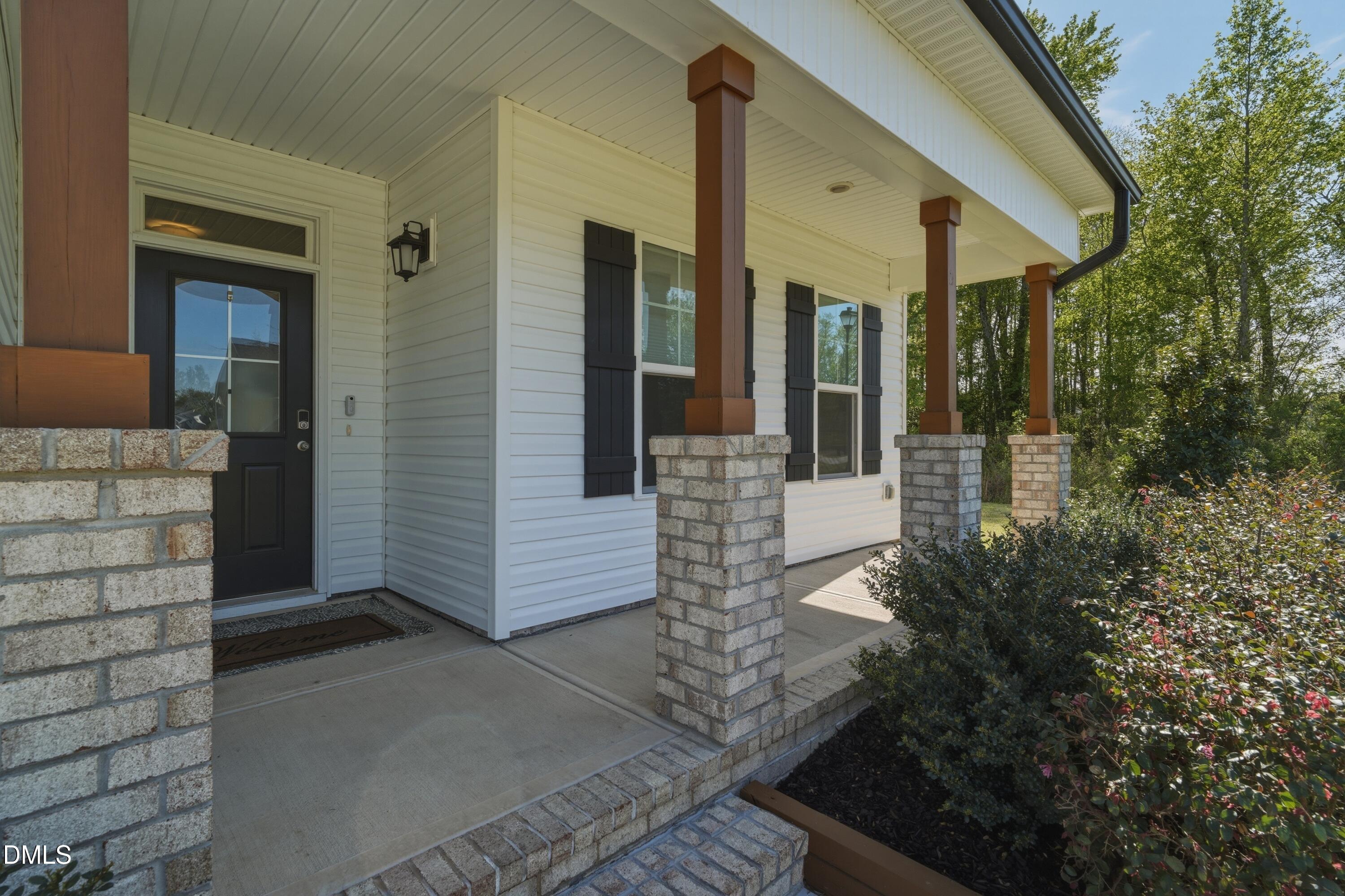 386 Howards Crossing Drive Wendell, NC 27591 - Photo 4 of 31 a porch with seating space