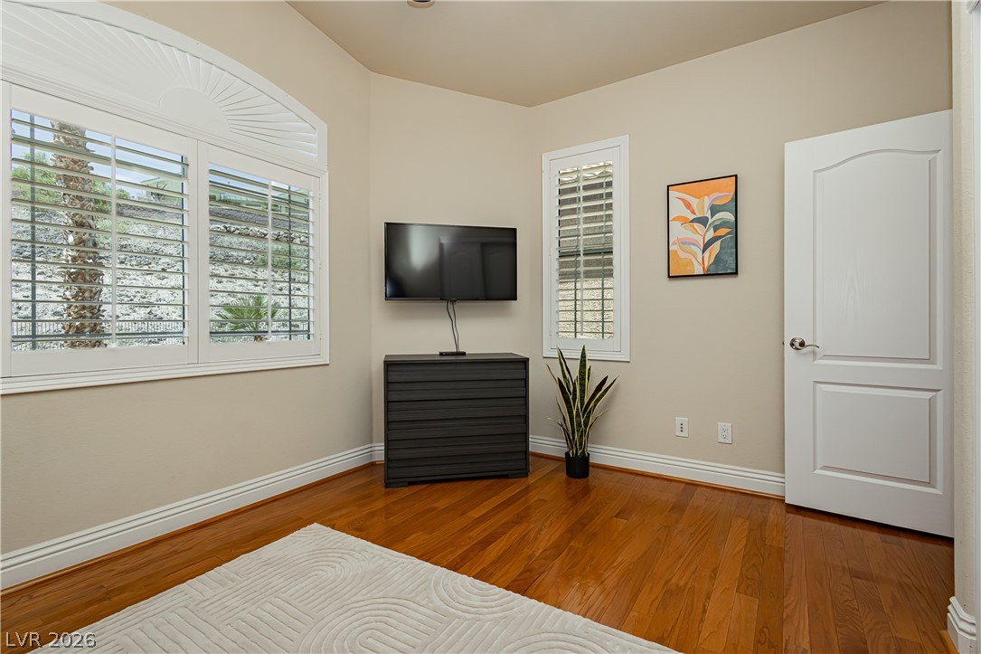 2256 Dogwood Ranch Avenue Henderson, NV 89052 - Photo 29 of 51 Hardwood floors and natural light illuminate this adaptable living space.