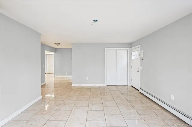 a view of an empty room and window