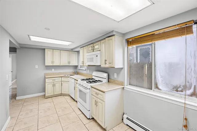 a kitchen with a stove a sink and a refrigerator
