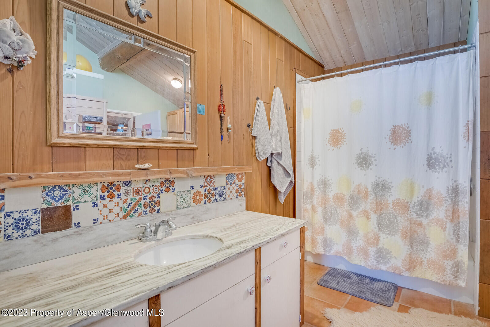 903 McLaughlin Lane Basalt, CO 81621 - Photo 11 of 28 a bathroom with a granite countertop sink and a mirror