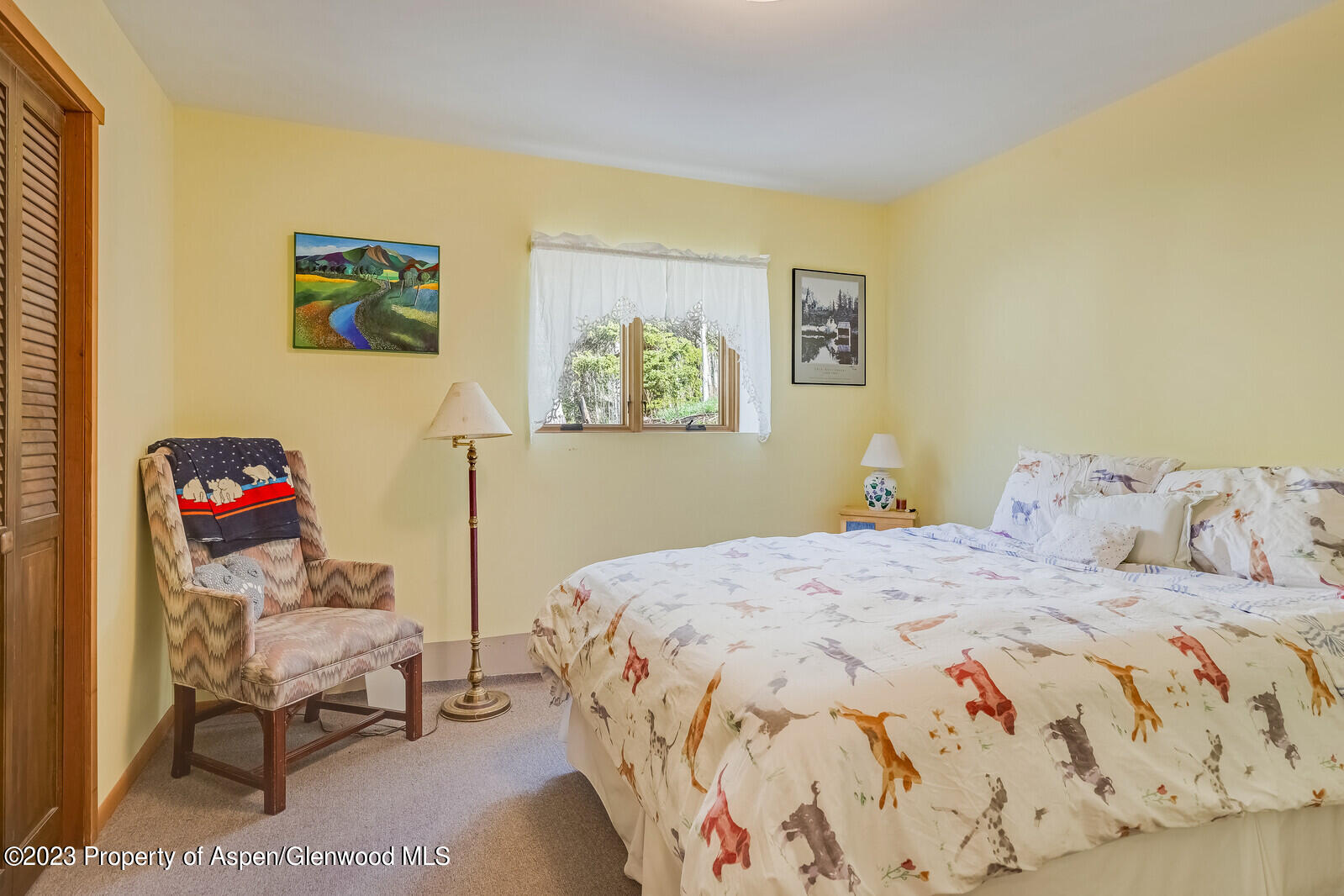 903 McLaughlin Lane Basalt, CO 81621 - Photo 14 of 28 a bedroom with a bed and wooden floor