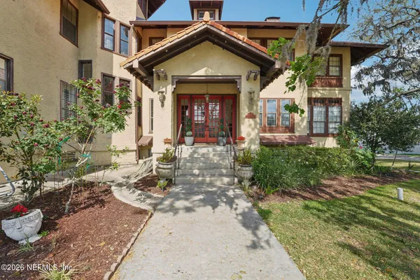 a front view of a house with garden