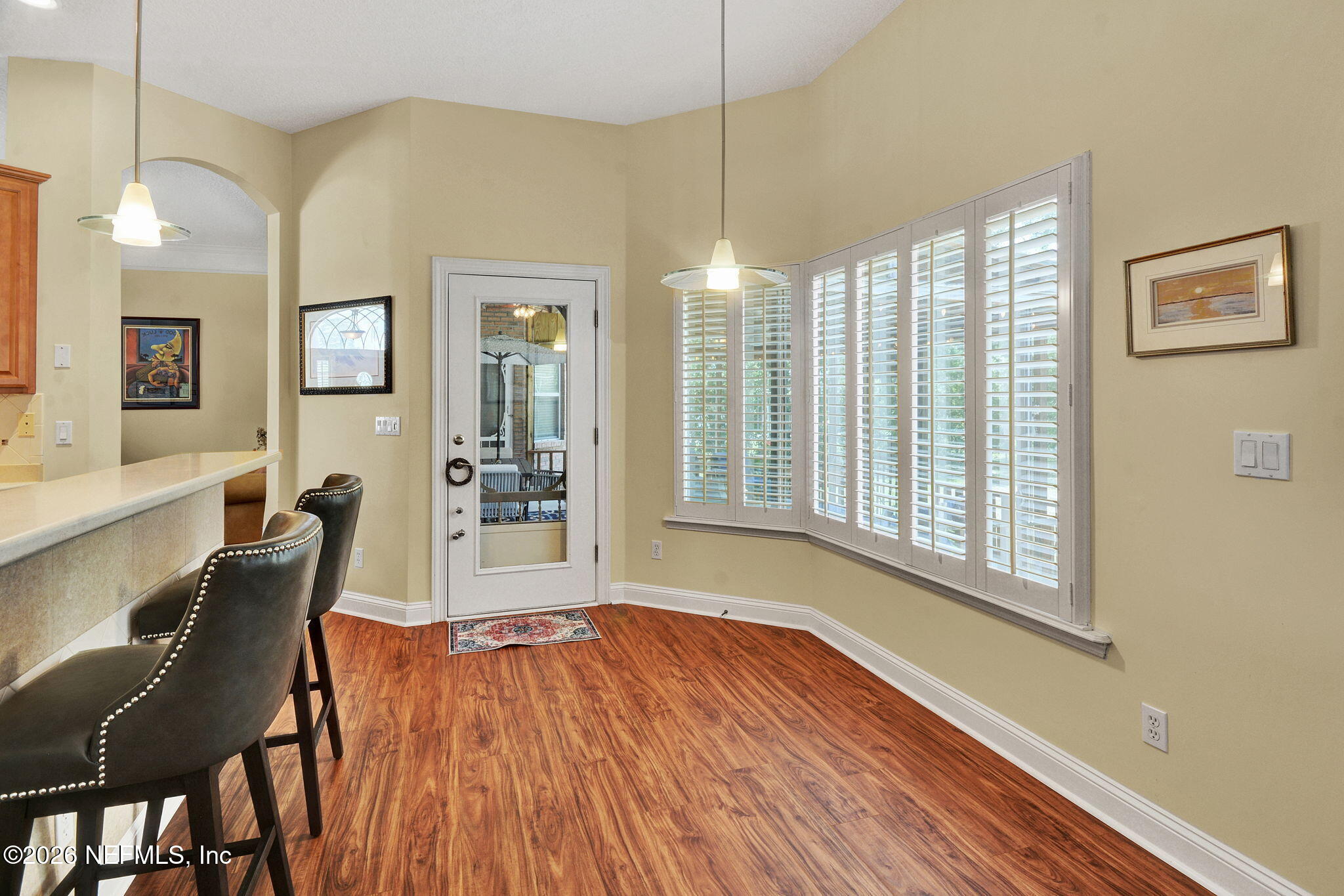 5950 West Shores Road Orange Park, FL 32003 - Photo 17 of 42 a view of a dining room with furniture and wooden floor