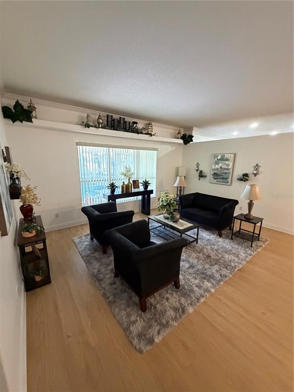 218 Piney Woods Road Apopka, FL 32703 - Photo 11 of 11 a living room with furniture and a large window