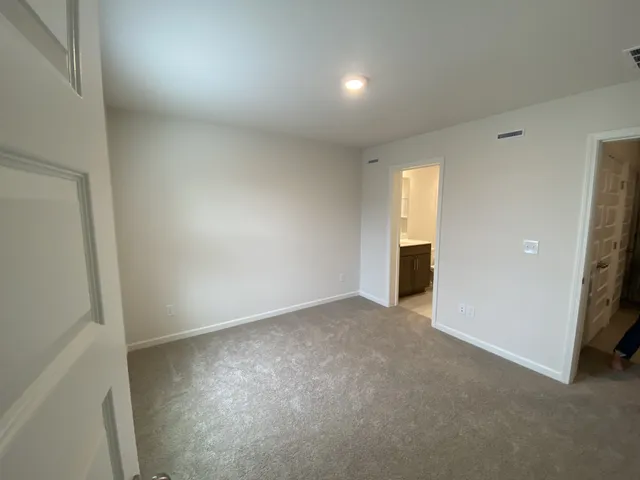 a view of an empty room and a window